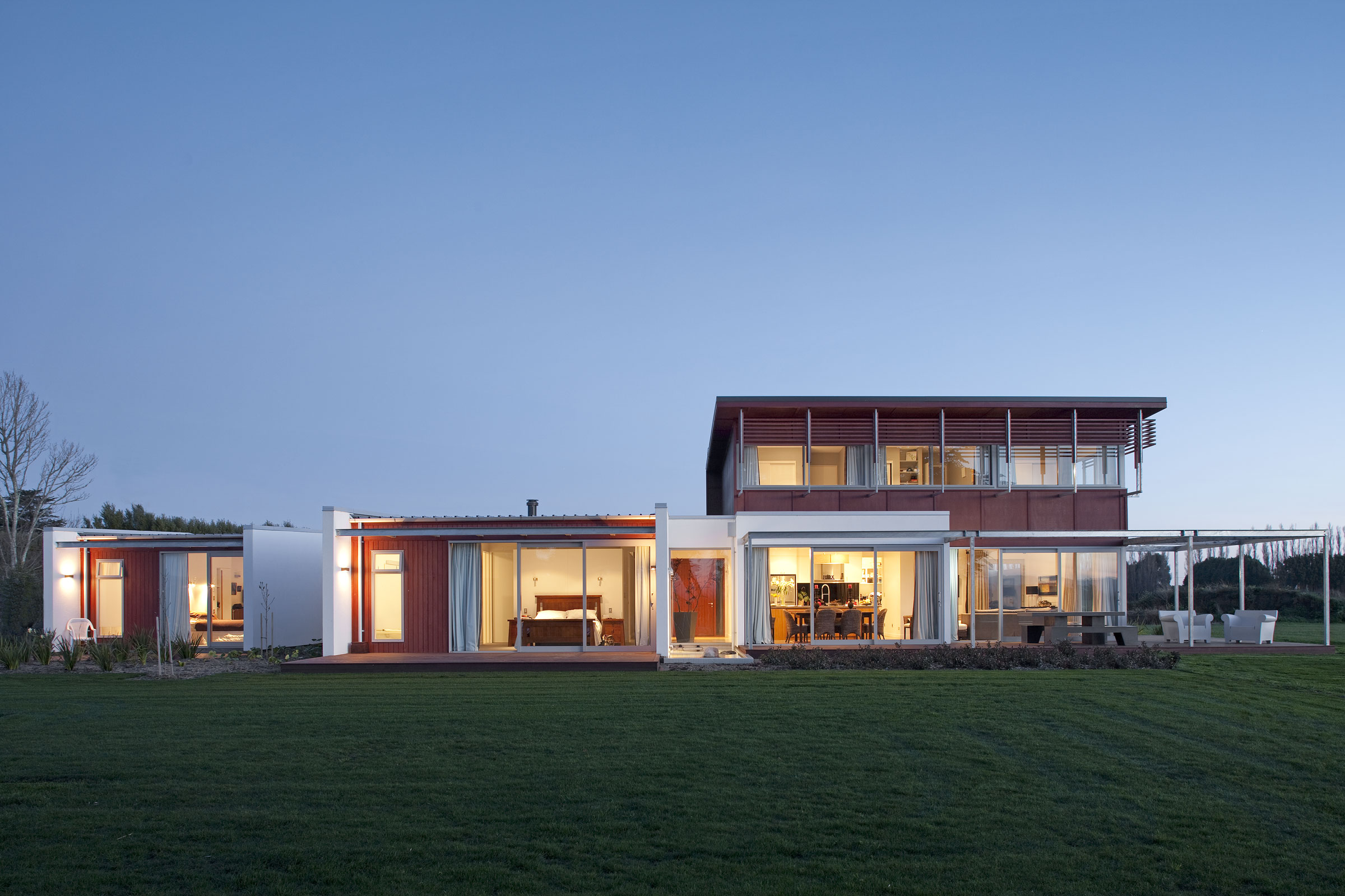 Exterior full view at dusk gathered pavilions house